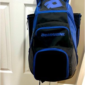 A softball bag with two bat holders